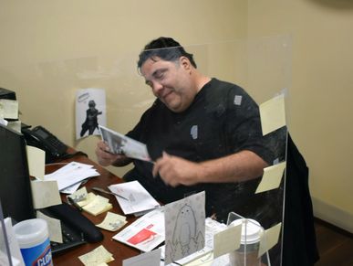 Portrait of John Hogan, Manager of debt collection operations.