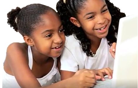 Two children having fun while using BEYOND, Children's Educational Software.