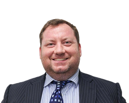 Smiling man in a pinstripe suit and patterned tie.