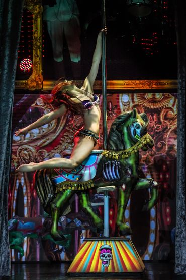 A sexy zombie pole routine on the zombie carousel horse