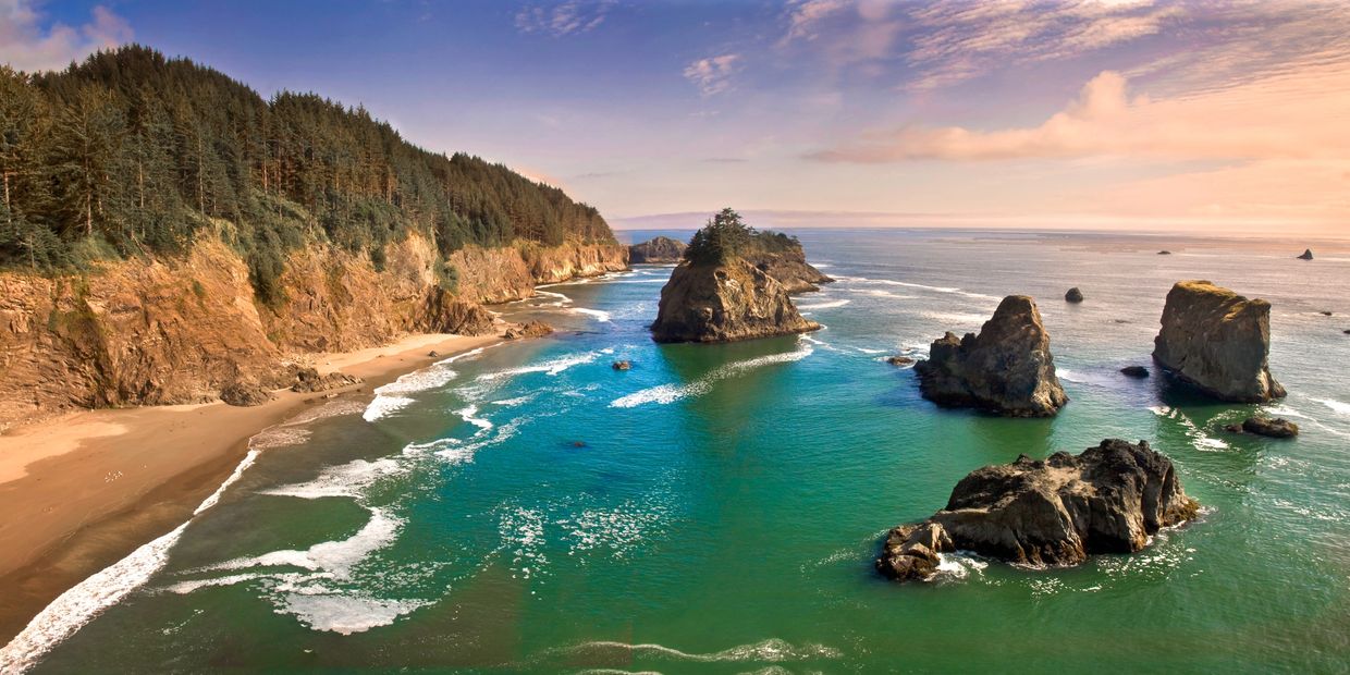 Mountains and huge rocks on a beach