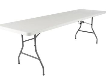 A long white folding table with metal legs.
