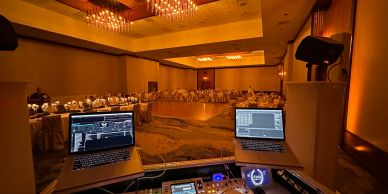 Wedding reception washed in warm uplighting at an Omaha-area venue