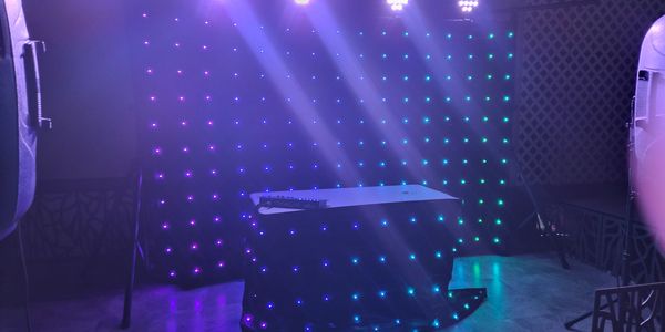 Our Motion drape curtain and moving heads and led par lighting .