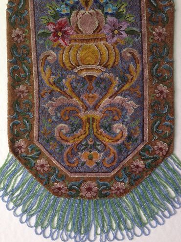 Large Victorian beaded purse, after restoration of unusual dual-length looped fringe. 