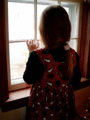 Maggie Sheppard waiting at the window for Grandpop / G-Pop Sheppard at home