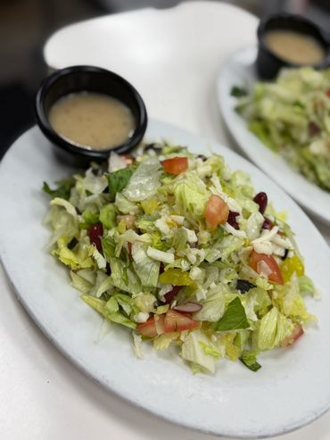 Large chopped salad with side dressing.