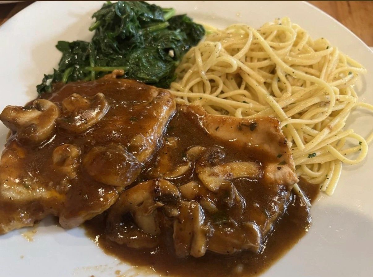 Chicken marsala served with buttery noodles.