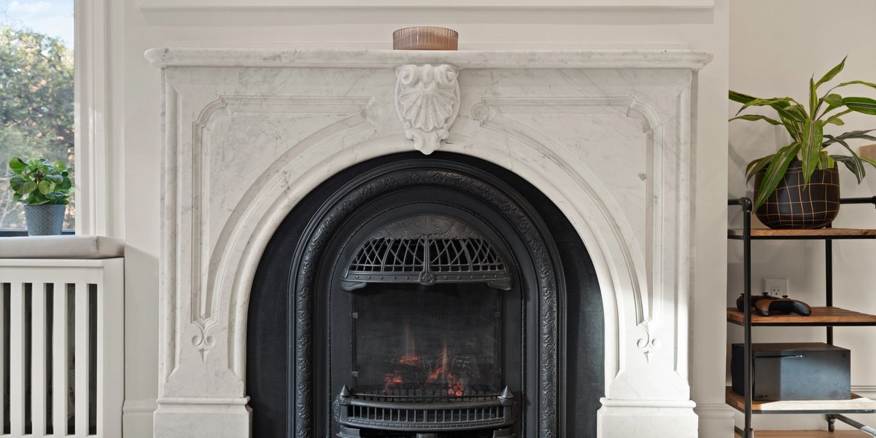 Original marble fireplace and period millwork in a Boston residence.