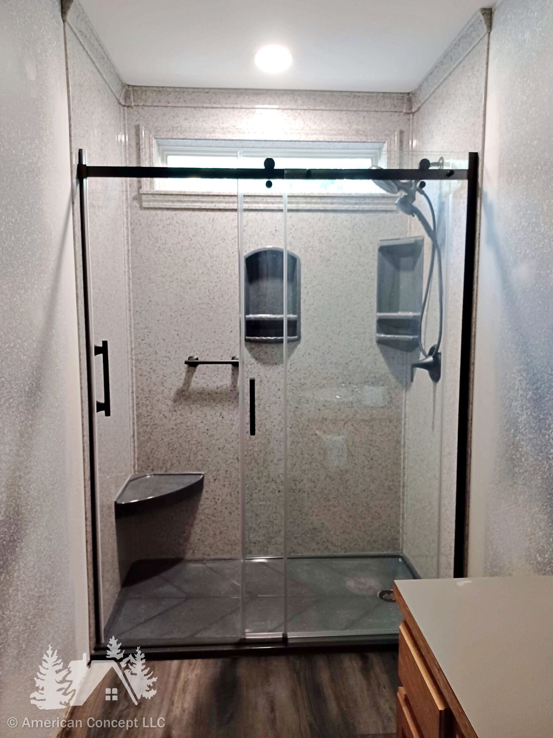 Onyx shower installation, with accessories in Gun Metal Gloss accenting a shower surround in Pepper