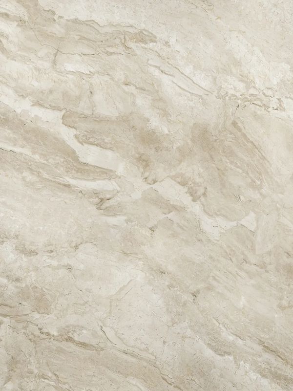 Beige marble texture with natural veins and patterns.