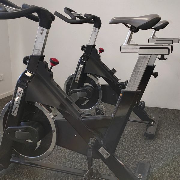 Two spin bikes side by side