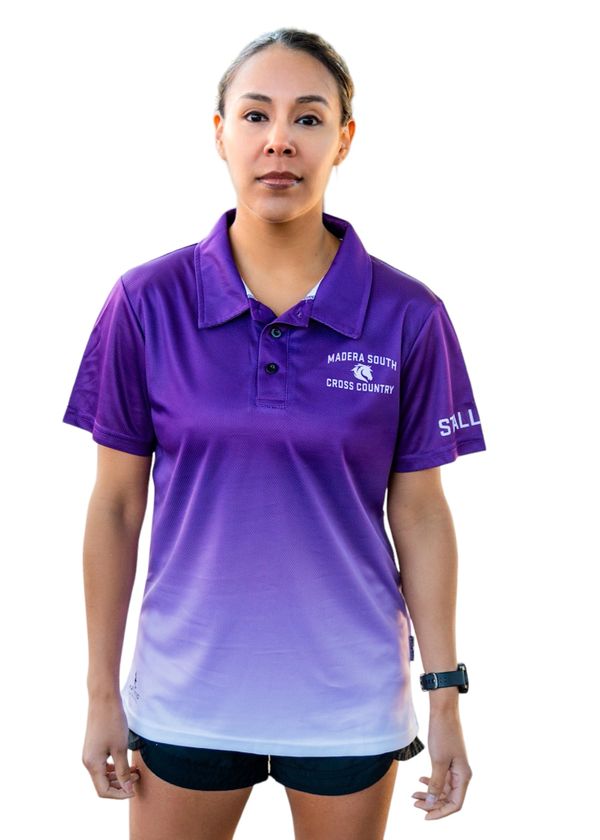 Woman wearing a purple Madera South Cross Country polo shirt and black shorts.