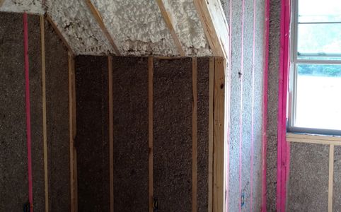cellulose insulation in the walls with open cell foam in the roof deck
