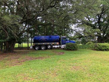 Blue septic pumping truck