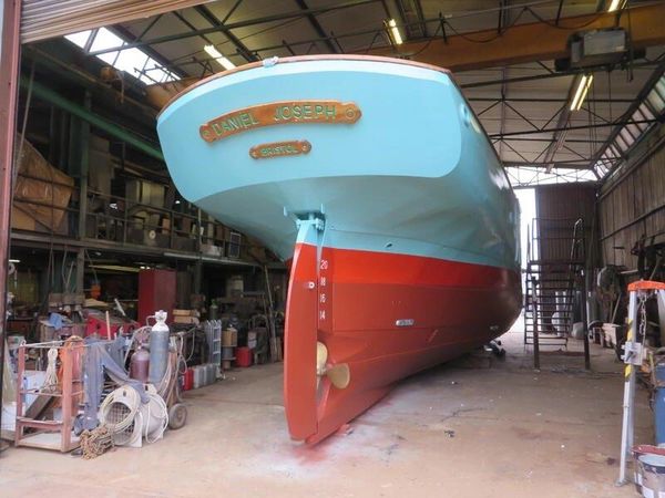 Boat named Daniel Joseph in a workshop.