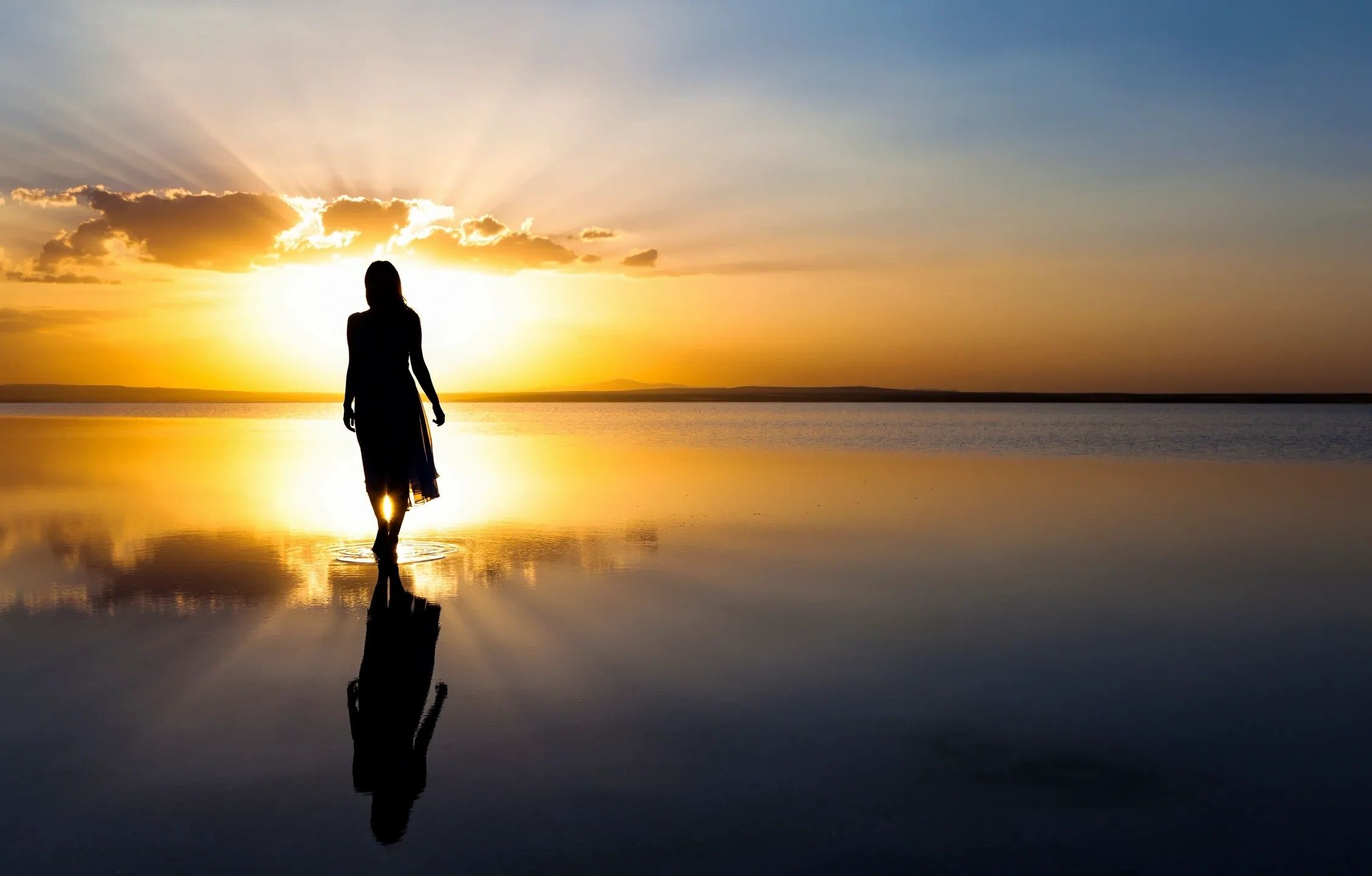 Picture of a woman walking on a beach