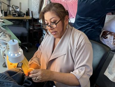 Luisa, one of our tailors at work