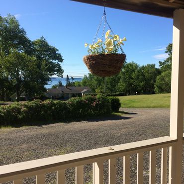 distant views of Penobscot Bay from covered front porch