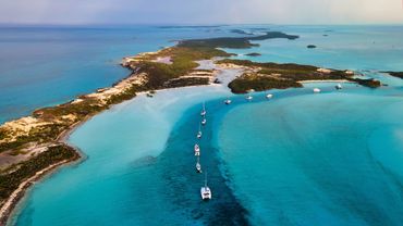 These warm shallow waters are so clear and turquoise in the Bahamas with warm temperatures all year