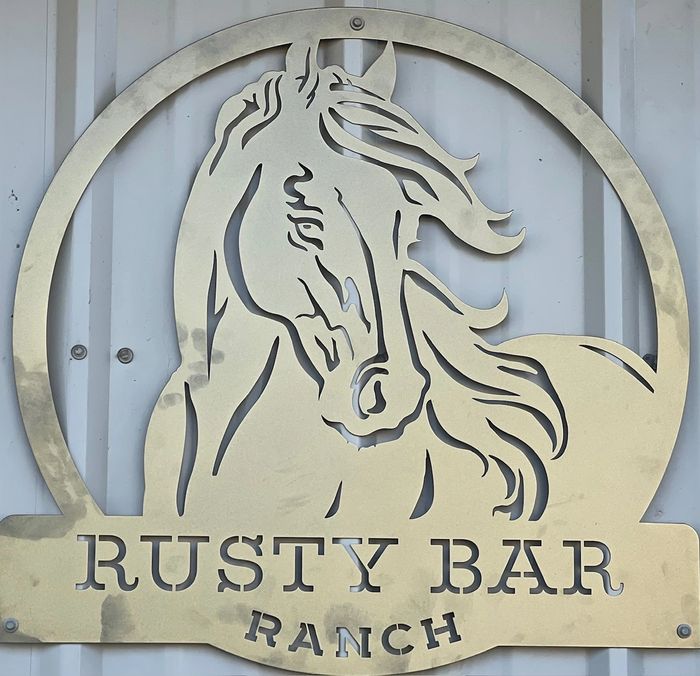 Rusty Bar Ranch sign with horse on face