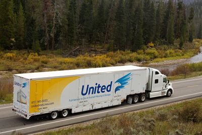 long distance driver
moving van
owner operator
moving truck driving  on street