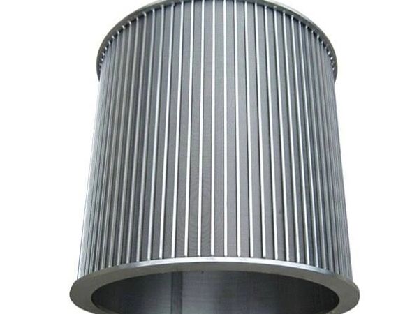 Large cylindrical metal industrial filter with vertical slats.
