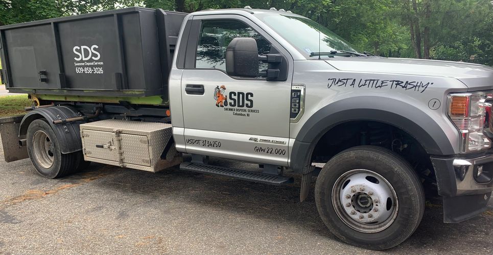 SDS - Swemmer Disposal Services truck “Just A Liitle Trashy” with a 6 yard dumpster.