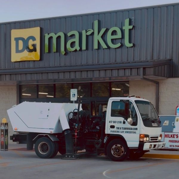 Dirty commercial parking lot with debris buildup in Springfield Missouri