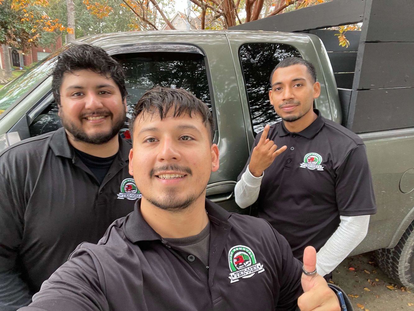 Three TexMexJunk team members standing in front of truck - Juan, Marco, and Danny