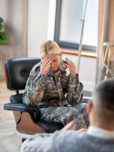 military woman in drug rehab attending a therapy session for a substance use disorder