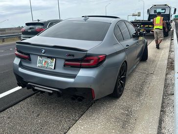 TP Towing recovering a car stuck off the shoulder of I-4