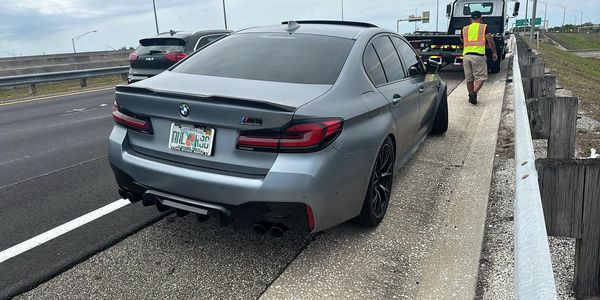 TP Towing responding to call on rainy Tampa evening