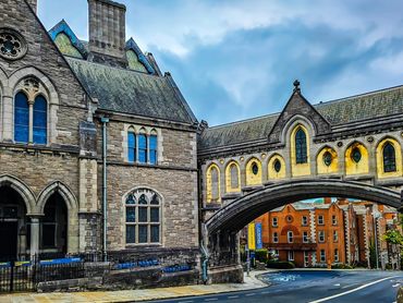 Historic stone buildings and an arched bridge in Dublin, Ireland.