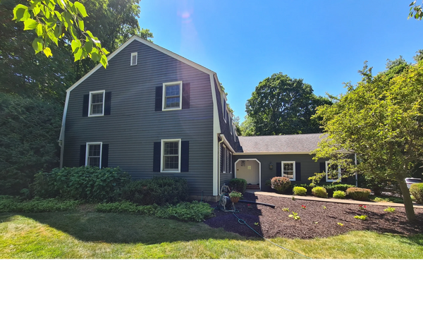 Painted exterior of house. Painted house trim, shutters, doors and garage.