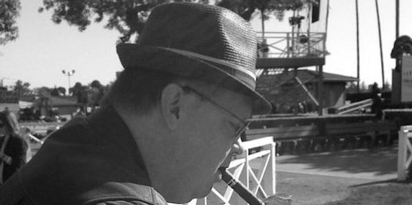 Eddie The Hat examines horses in Santa Anita Paddock