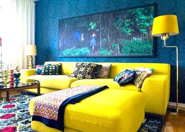 yellow couch blue walls