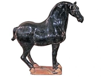 Black horse sculpture on a rectangular base.