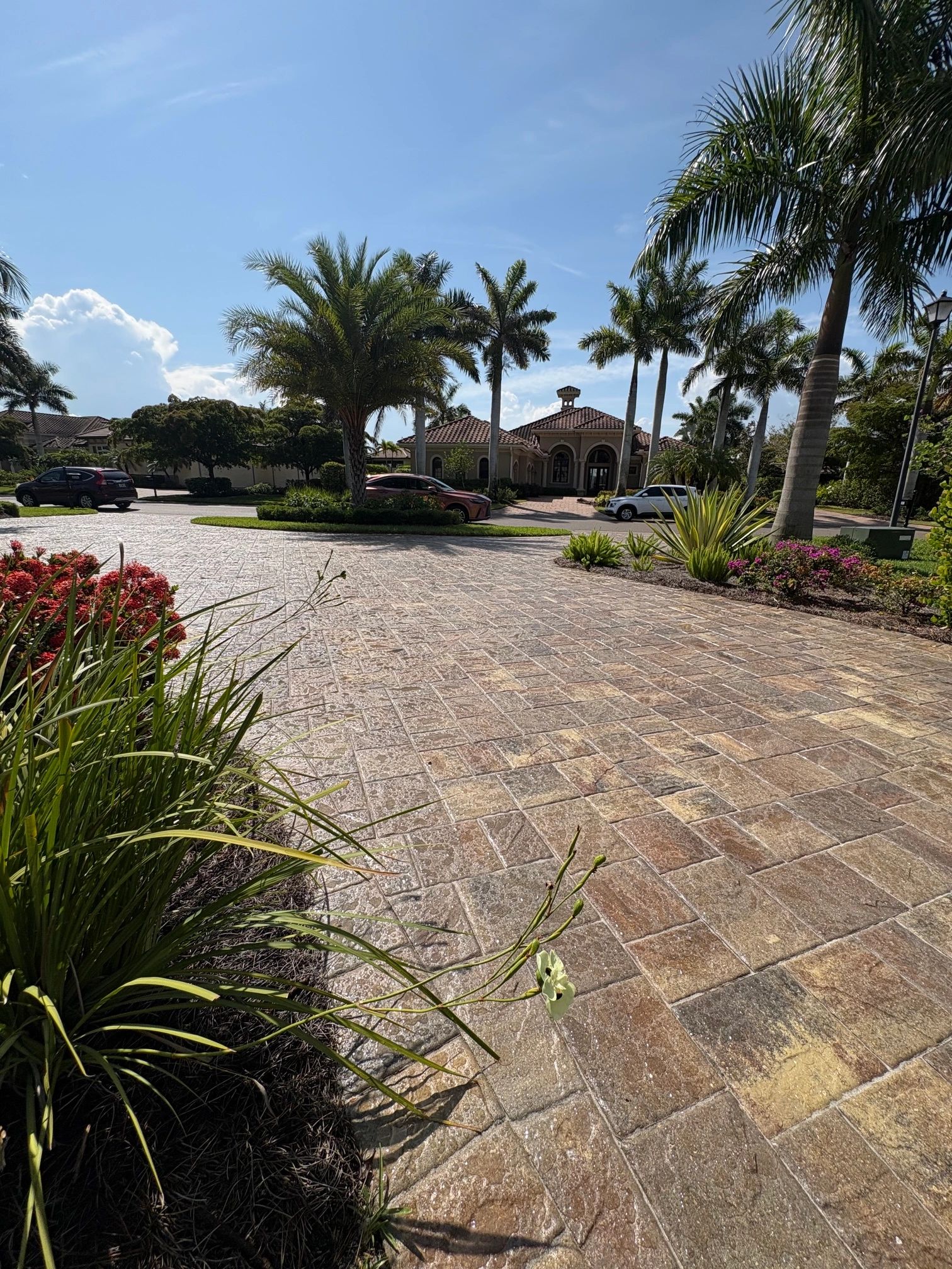 Custom interlocking paver driveway installation featuring a sealed paved entrance in Southwest Flori