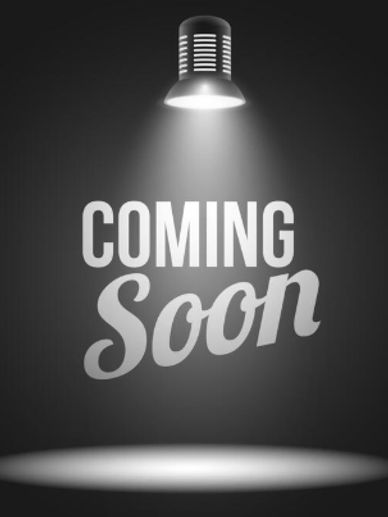 Black and white image with 'COMING Soon' text under a spotlight.