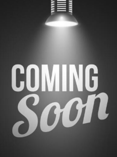 Black and white image with 'COMING Soon' text under a spotlight.
