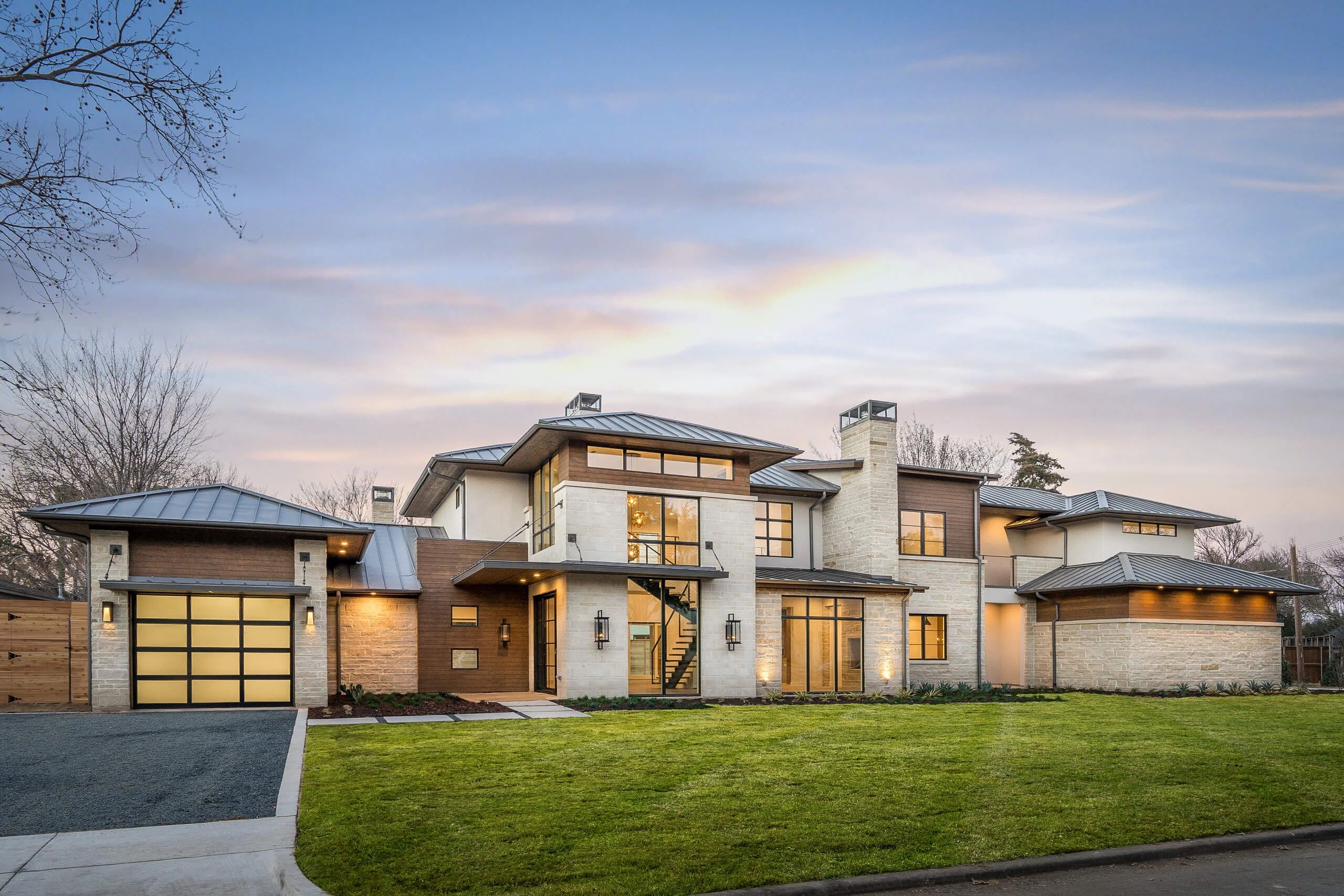 contemporary home exterior design with glass garage doors