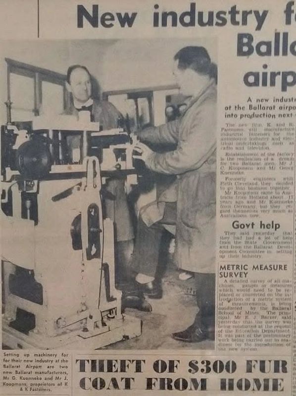 Two men setting up industrial machinery at Ballarat Airport.
