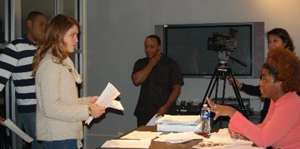 Whitney Valcin directing an actor at a casting call.