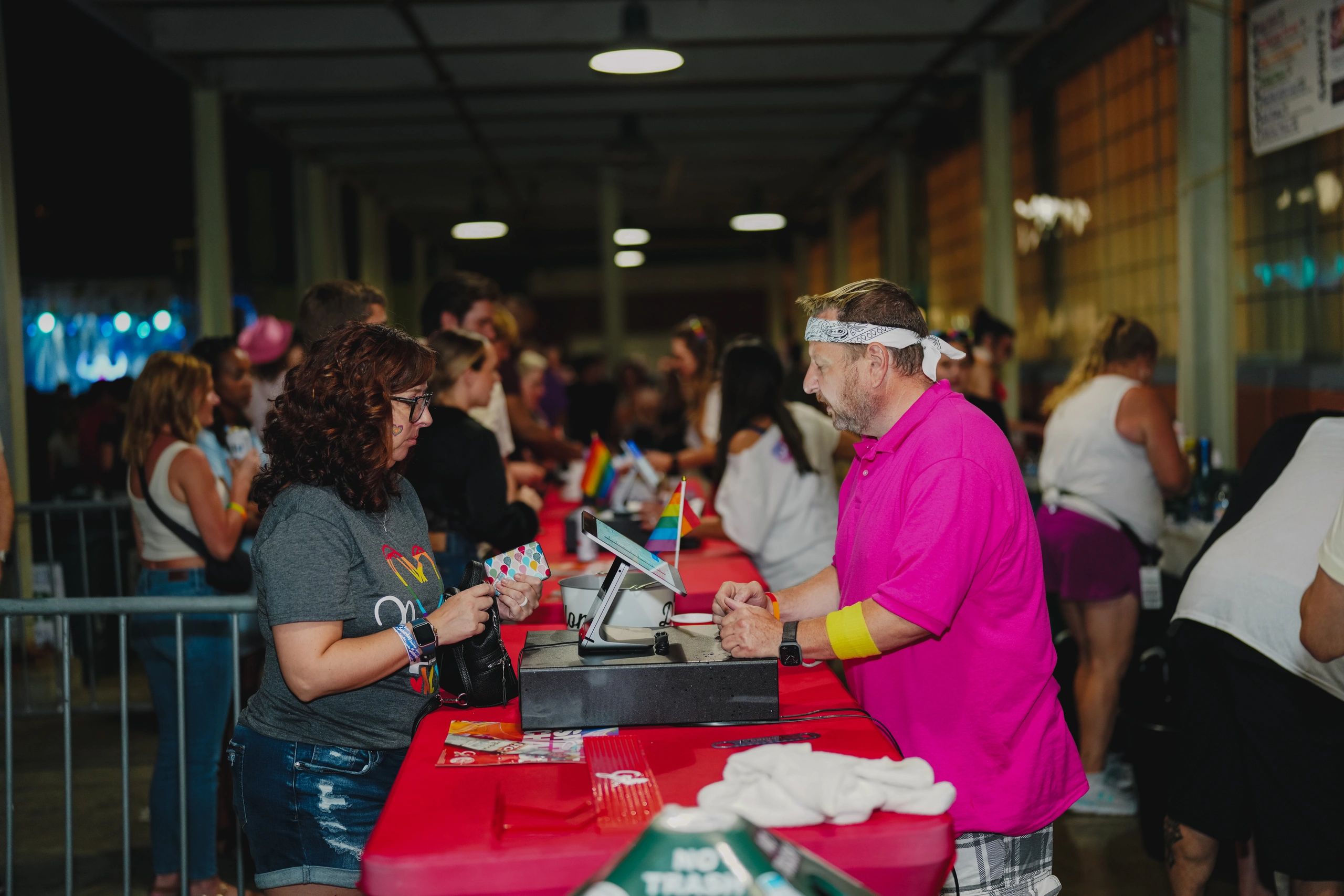 Customer at Pride Royal Oak purchases a beverage.