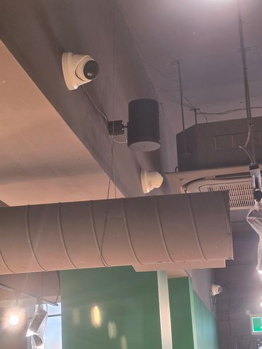 Ceiling with security cameras and ventilation.