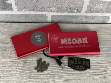 Banacom Signs & More Employee Lasered Power Bank in Hiawatha Iowa