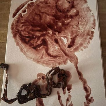 A placenta print and cord keepsake shaped into love