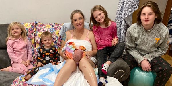 The doula after her home birth with some of her children