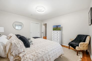 Master bedroom with king bed and smart TV